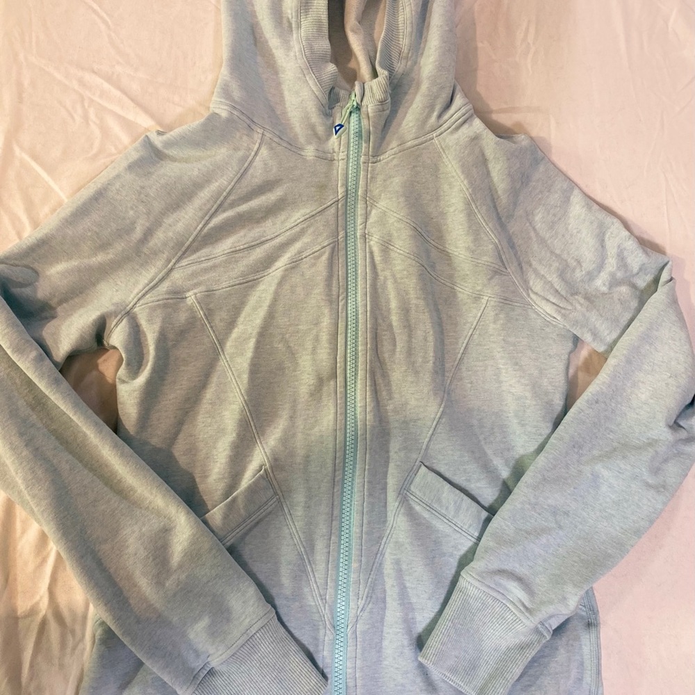 teal, zip up sweatshirt